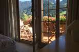 Enjoy breathtaking mountain views from this charming balcony.