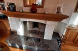 This cozy living space features a charming fireplace, perfect for creating a warm and inviting atmosphere.