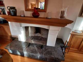 This cozy living space features a charming fireplace, perfect for creating a warm and inviting atmosphere.