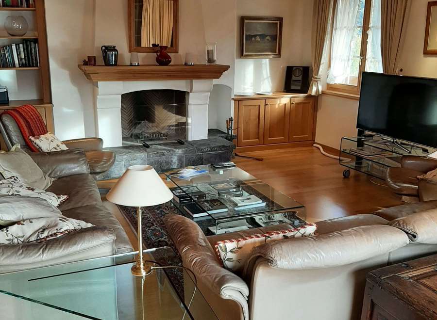 This cozy living room features a stunning fireplace, perfect for those chilly evenings.