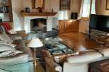 This cozy living room features a stunning fireplace, perfect for those chilly evenings.