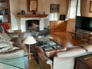 This cozy living room features a stunning fireplace, perfect for those chilly evenings.