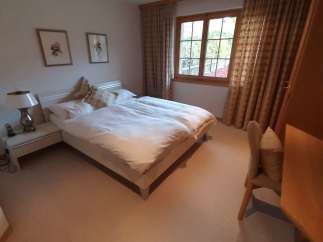 Cozy bedroom with a comfortable double bed, perfect for a relaxing stay.