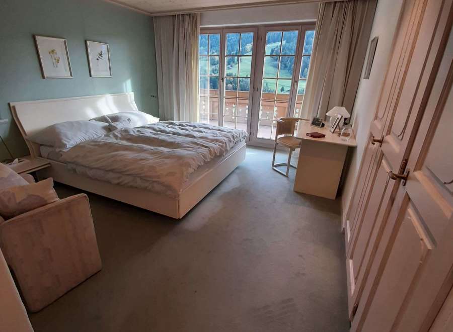 Discover a serene bedroom retreat with stunning mountain views.