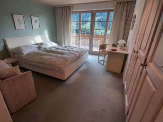 Discover a serene bedroom retreat with stunning mountain views.
