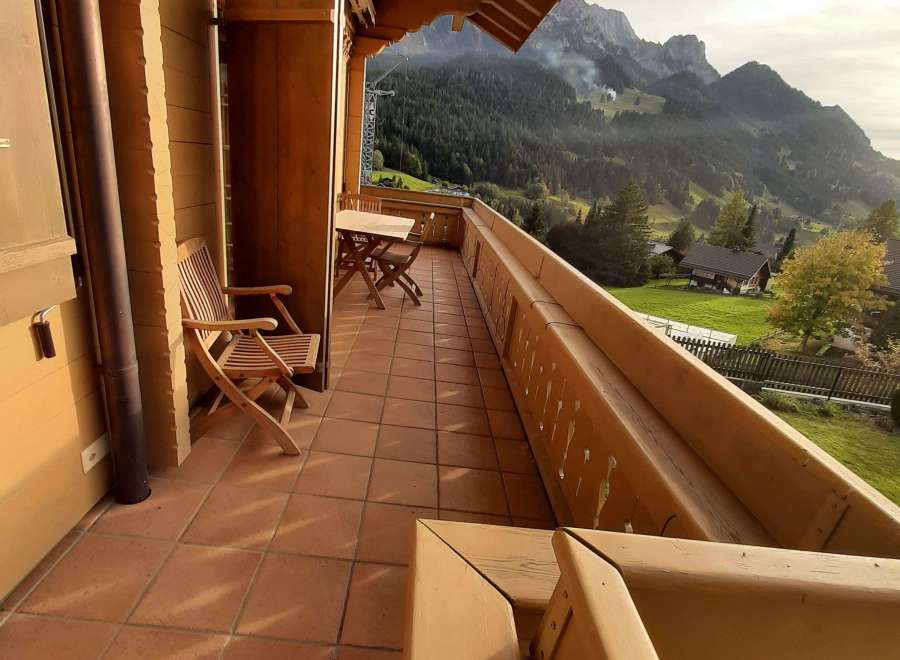 Enjoy breathtaking mountain views from this charming balcony.