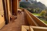 Enjoy breathtaking mountain views from this charming balcony.