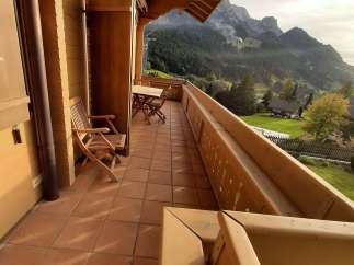 Enjoy breathtaking mountain views from this charming balcony.