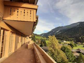 Enjoy breathtaking mountain views from this stunning balcony.