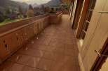Enjoy breathtaking mountain views from this charming balcony.