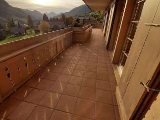 Enjoy breathtaking mountain views from this charming balcony.