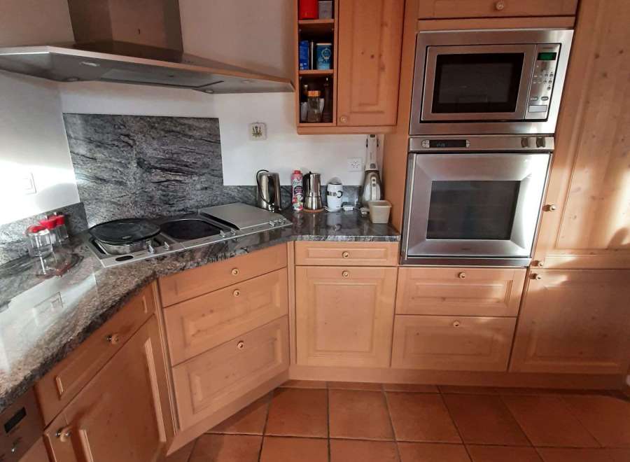 This stunning kitchen boasts a modern design with sleek stainless steel appliances.