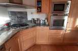 This stunning kitchen boasts a modern design with sleek stainless steel appliances.