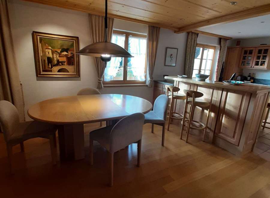 This charming property boasts a warm and inviting interior with a beautiful wooden ceiling and flooring.