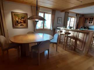 This charming property boasts a warm and inviting interior with a beautiful wooden ceiling and flooring.