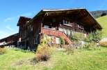 Discover the charm of this traditional wooden house nestled in a picturesque landscape.