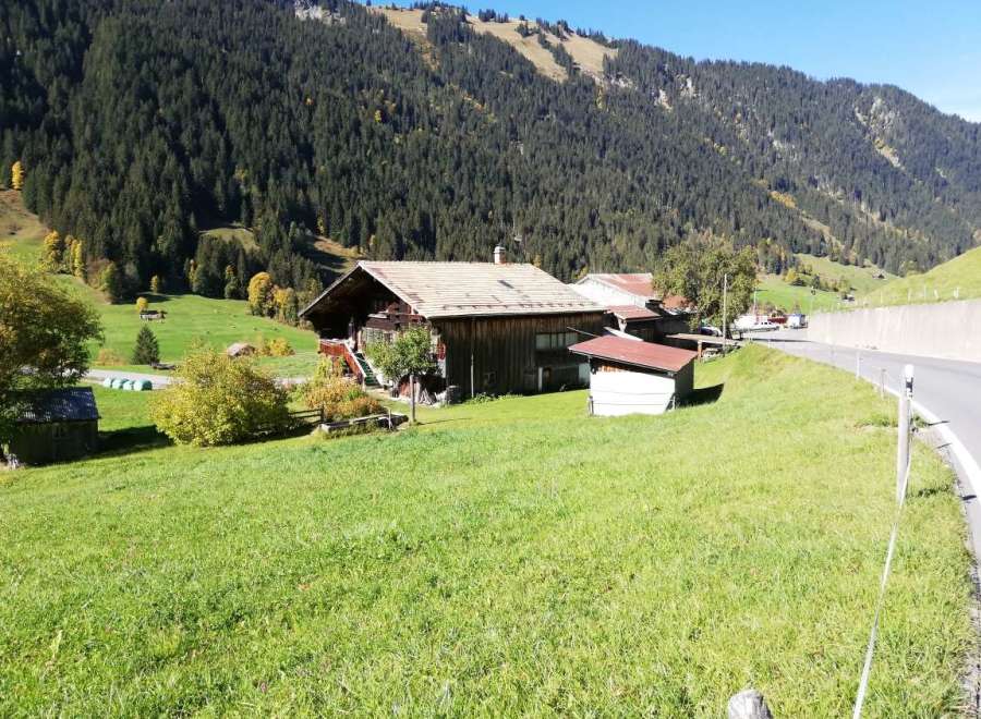 Nestled in a picturesque mountain landscape, this charming property offers a serene escape.