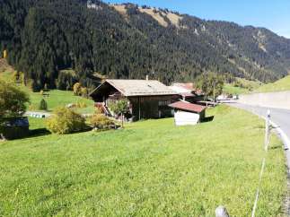 Nestled in a picturesque mountain landscape, this charming property offers a serene escape.