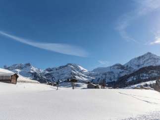 Experience the serene beauty of the Swiss Alps in winter.