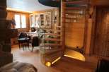 Experience rustic elegance in this stunning property, featuring a beautiful wooden spiral staircase.