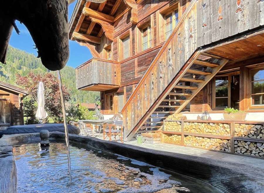 Experience the charm of this stunning wooden chalet, showcasing intricate architectural details.