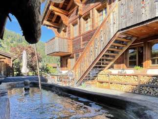 Experience the charm of this stunning wooden chalet, showcasing intricate architectural details.