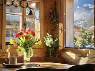 Experience the charm of this cozy cabin with stunning mountain views.