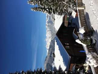 Experience the ultimate winter getaway in this charming chalet nestled in the snowy mountains.