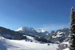 Experience the breathtaking beauty of a snow-covered mountain landscape.