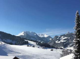 Experience the breathtaking beauty of a snow-covered mountain landscape.