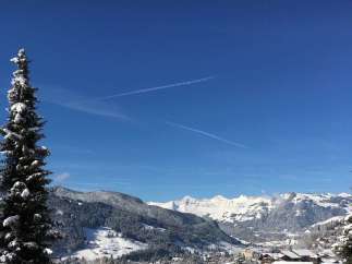 Experience the breathtaking beauty of a snow-covered mountain landscape.