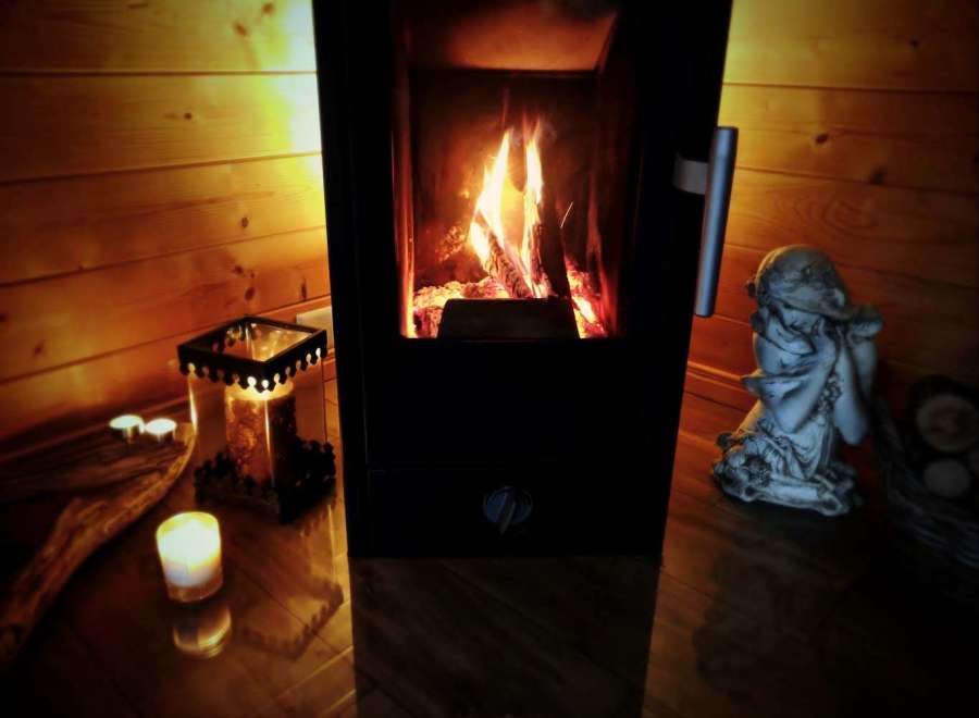 Cozy up in this inviting space, featuring a warm fireplace and charming wooden accents.