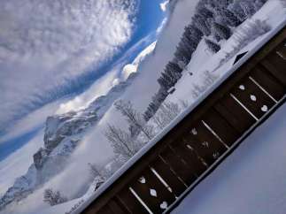 Experience the breathtaking beauty of the snow-covered mountains from this stunning property.