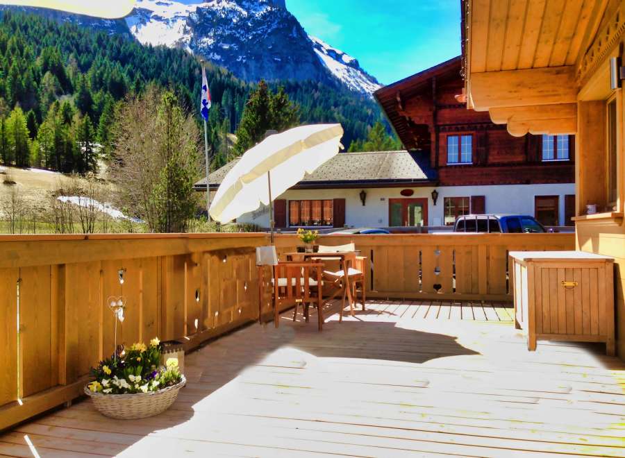 Enjoy the stunning mountain views from this charming wooden deck.