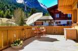 Enjoy the stunning mountain views from this charming wooden deck.