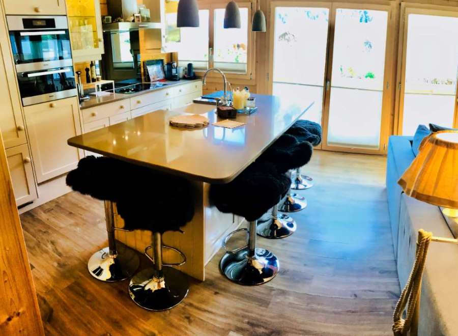 This stunning kitchen boasts a modern design with a sleek island, perfect for entertaining.