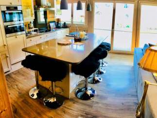 This stunning kitchen boasts a modern design with a sleek island, perfect for entertaining.