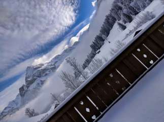 Experience the breathtaking beauty of the snow-covered mountains from this stunning property.