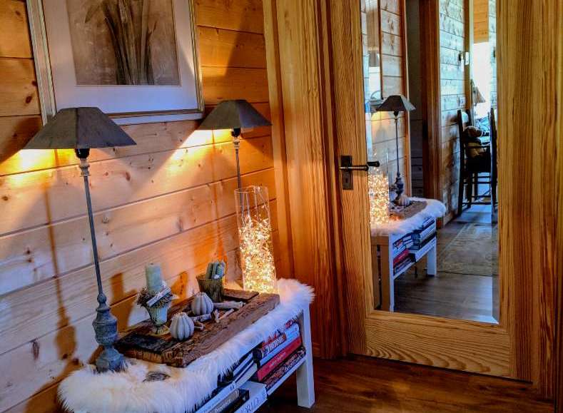 This cozy space features beautiful wood paneling and a warm, inviting atmosphere.