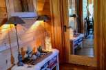 This cozy space features beautiful wood paneling and a warm, inviting atmosphere.