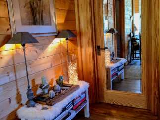 This cozy space features beautiful wood paneling and a warm, inviting atmosphere.