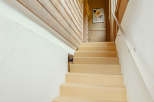 This inviting staircase leads to a cozy interior.