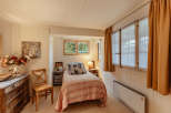 Cozy bedroom with a charming, vintage aesthetic.