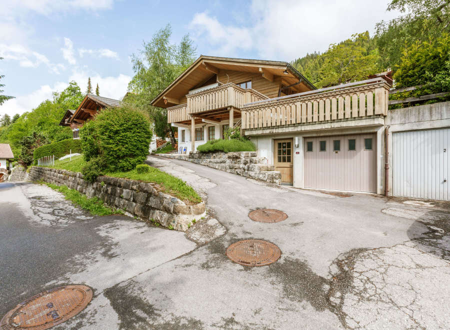 Charming wooden chalet nestled in a picturesque mountain setting.
