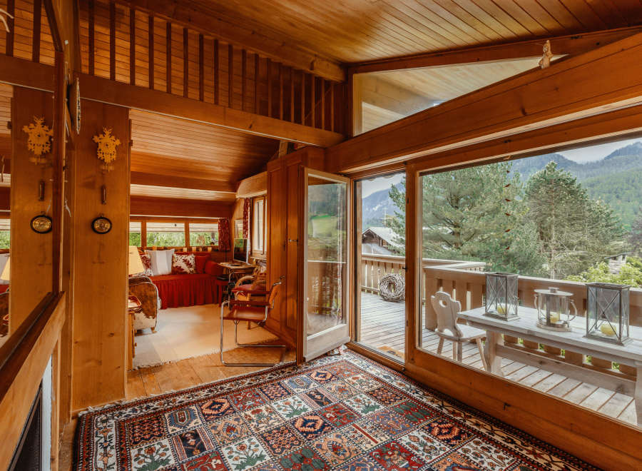 Step into a cozy chalet with stunning mountain views.