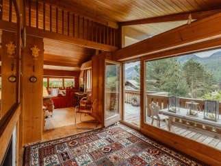 Step into a cozy chalet with stunning mountain views.