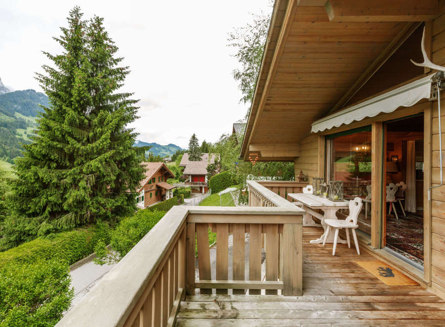 Enjoy breathtaking mountain views from this charming wooden chalet.