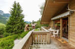 Enjoy breathtaking mountain views from this charming wooden chalet.