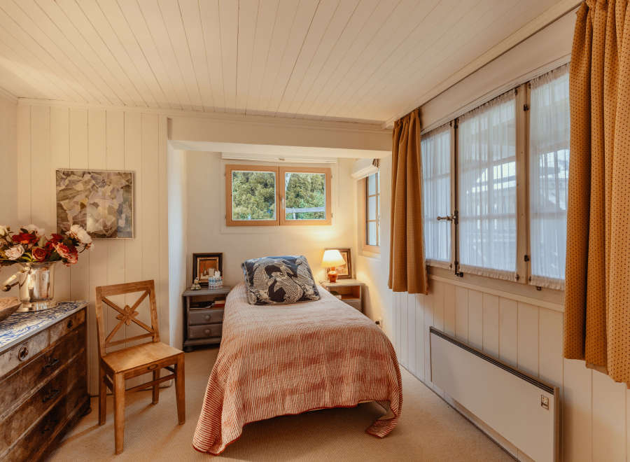 Cozy bedroom with a charming, vintage aesthetic.