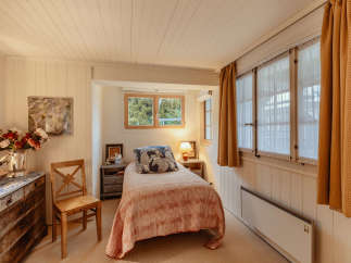 Cozy bedroom with a charming, vintage aesthetic.